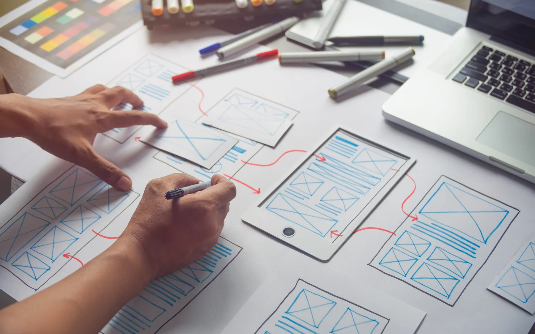 person sketching wireframe Plastic Surgery Marketing Agency